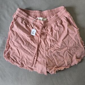 Light pink cotton drawstring shorts with side pockets